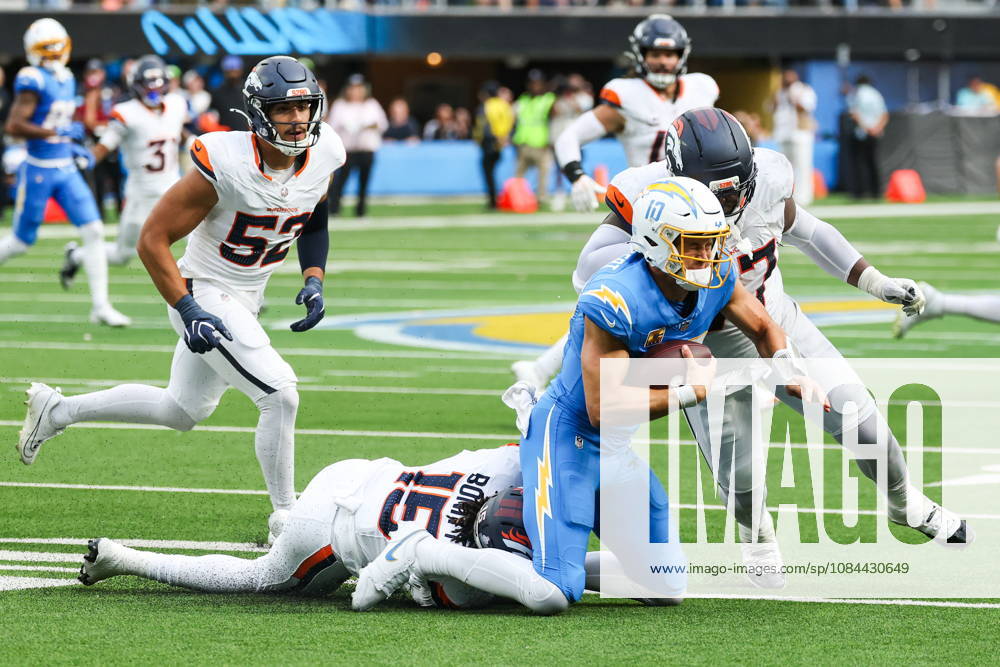 NFL, American Football Herren, USA - Los Angeles Chargers vs Denver Broncos Los Angeles Chargers quarterback Justin Herbert (10) is sacked by Denver Broncos outside linebacker Nik Bonitto (15) and defensive tackle Malcolm Roach (97) during the second half of an NFL football game at SoFi Stadium in Inglewood, California, USA, 11 October 2026. INGLEWOOD CALIFORNIA UNITED STATES