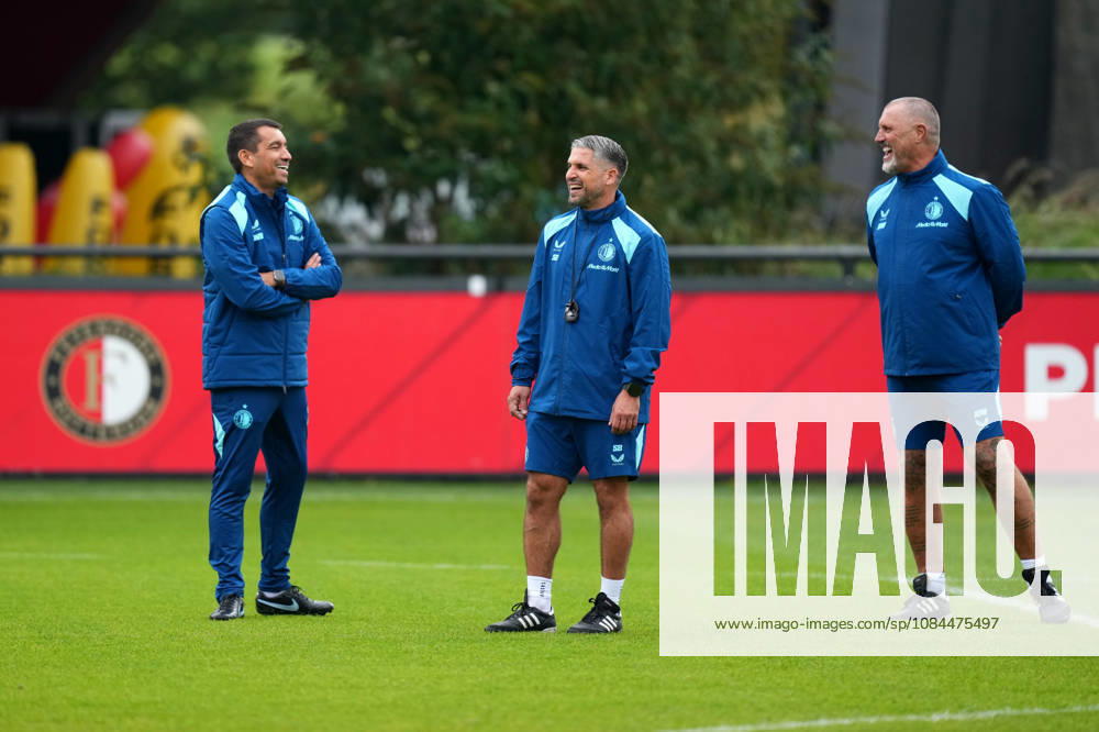 Training Champions League Feyenoord Rotterdam 2026 2027 Rotterdam - Coach Giovanni van Bronckhorst of Feyenoord Rotterdam shares a laugh with Assistant coach Said Bakkati of Feyenoord Rotterdam and Assistant coach John de Wolf of Feyenoord Rotterdam during a training before the Champions League match against Como 1907. The training is set at Trainingscomplex 1908 on 13 October 2026 in Rotterdam, Netherlands. (Hero Images Yannick Verhoeven)