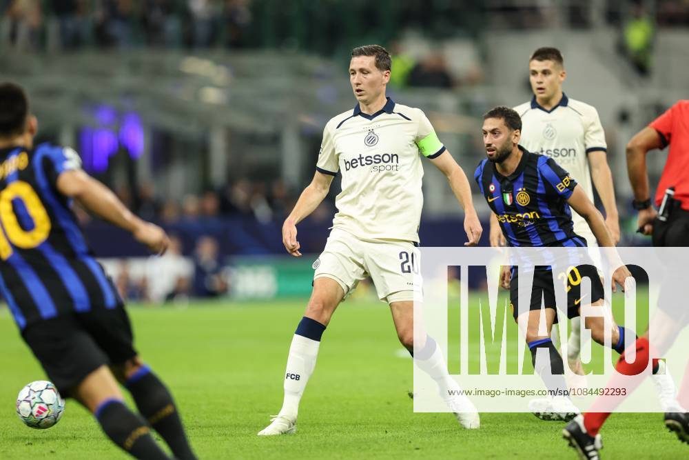 Club s Hans Vanaken and Inter s Hakan Calhanoglu fight for the ball during a soccer game between Italian Inter Milan and Belgian Club Brugge KV, Tuesday 13 October 2026 in Milan, Italy, on day 2 of the UEFA Champions League league phase. BRUNOxFAHY x189713920x
