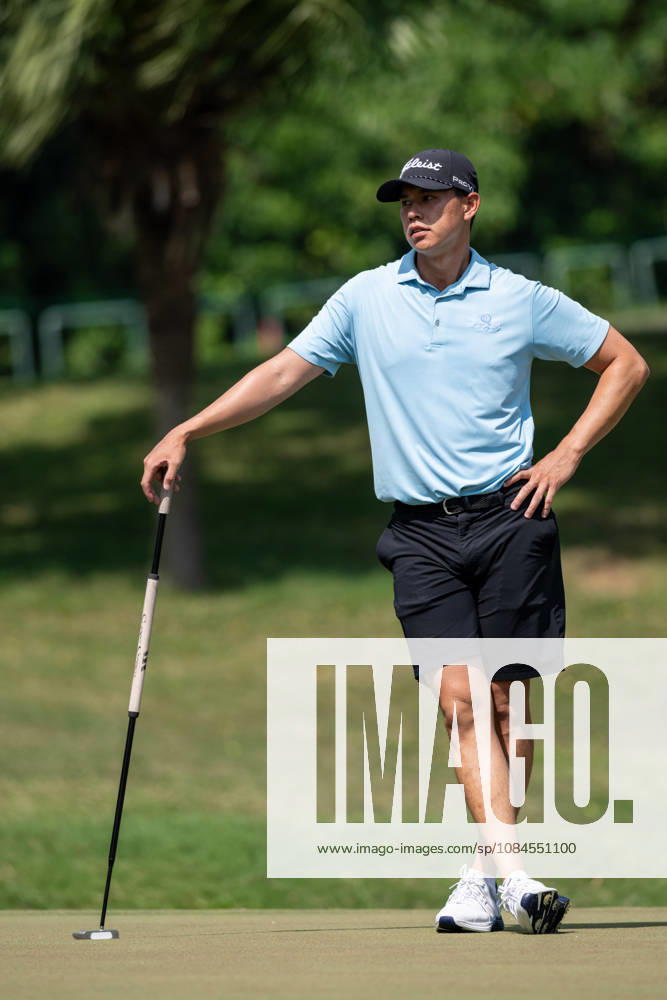 Hong Kongâ€⠢s Matthew CHEUNG on the 9th green for their round.Opening Round in the Macao Open Golf at Macau Golf & Country Club. Coloane China - ZUMAr144 20261015_zap_r144_159