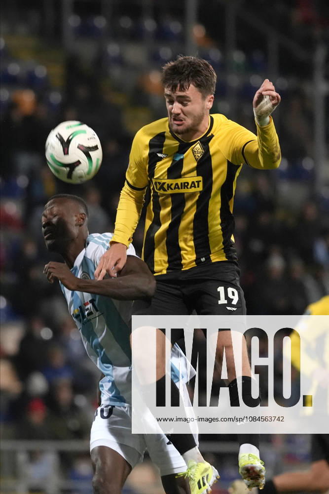 Oiva Jukkola of Kairat and Ahmed Ankrah of Riga FC compete for the ball during a UEFA Conference League soccer match between Latvias Riga FC and Kazakhstans Kairat Almaty at Skonto Stadium in Riga, Latvia, Thursday, Oct. 15, 2026. Riga Latvia