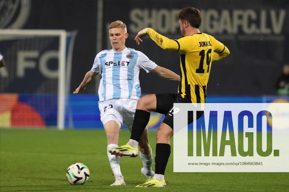 Maksims Tonisevs of Riga FC and Oiva Jukkola of Kairat compete for the ball during a UEFA Conference League soccer match between Latvias Riga FC and Kazakhstans Kairat Almaty at Skonto Stadium in Riga, Latvia, Thursday, Oct. 15, 2026. Riga Latvia