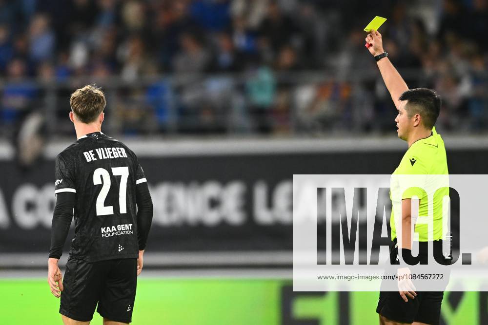 KAA Gent v AGF Aarhus - UEFA Conference League GENT, BELGIUM - OCTOBER 15 : De Vlieger Tibe midfielder of KAA Gent receives a yellow card from referee during the UEFA Conference League 2026 27 League Phase matchday 1 match between KAA Gent and AGF Aarhus on October 15, 2026 in Gent, Belgium, 15 10 2026 Gent Belgium