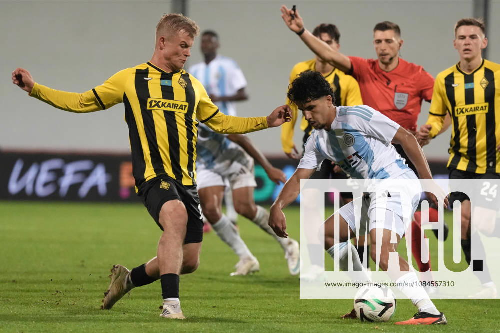 Salah Oulad M Hand of Riga FC and Jaakko Oksanen of Kairat compete for the ball during a UEFA Conference League soccer match between Latvias Riga FC and Kazakhstans Kairat Almaty at Skonto Stadium in Riga, Latvia, Thursday, Oct. 15, 2026. Riga Latvia