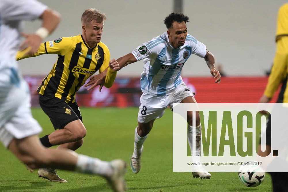 Iago Siqueira of Riga FC and Jaakko Oksanen of Kairat compete for the ball during a UEFA Conference League soccer match between Latvias Riga FC and Kazakhstans Kairat Almaty at Skonto Stadium in Riga, Latvia, Thursday, Oct. 15, 2026. Riga Latvia