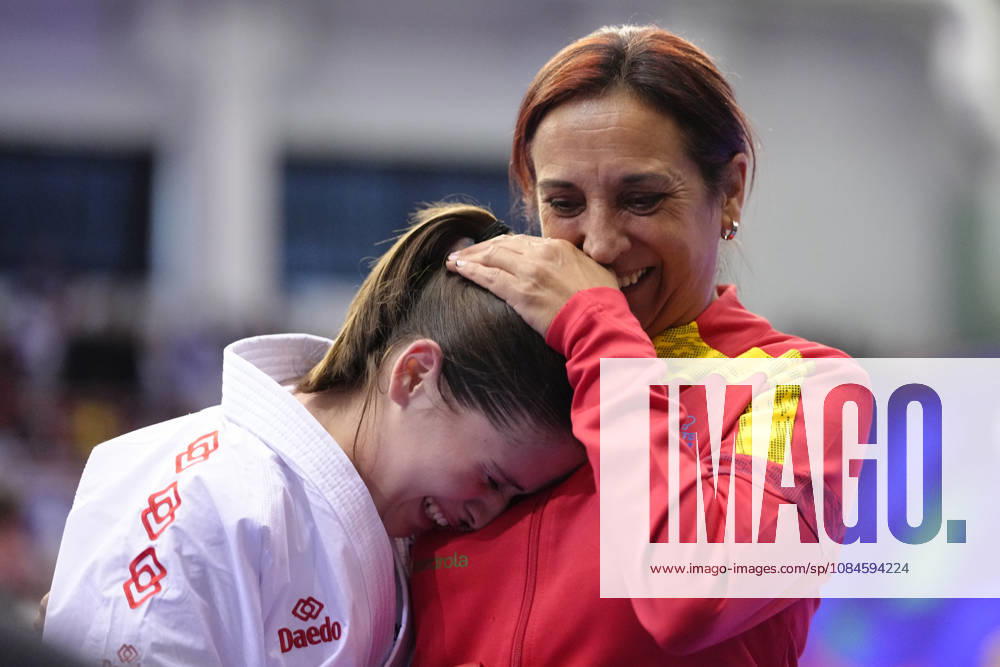 2026 World Cadet, Junior & U21, U 21 Karate Championships BIELSKO-BIALA, POLAND - OCTOBER 16: Celia Cofradas Del Castillo of Spain celebrates victory with her coach after the cadet female kumite -47kg semi-final at the 2026 World Cadet, Junior & U21 Karate Championships at Hala Pod Debowcem on October 16, 2026 in Bielsko-Biala, Poland. Bielsko-Biala Hala Pod Debowcem Poland