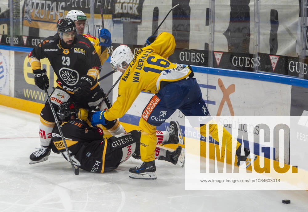 Giovanni Morini of Lugano L) and Olle Lycksell of Lugano C) against Calle Andersson of Davos 2nd L) and Guus Van der Kaaij of Davos R) during the game between HC Lugano v HC Davos at the Corner Arena on October 16, 2026 in Lugano, Switzerland. Lugano Ticino Switzerland