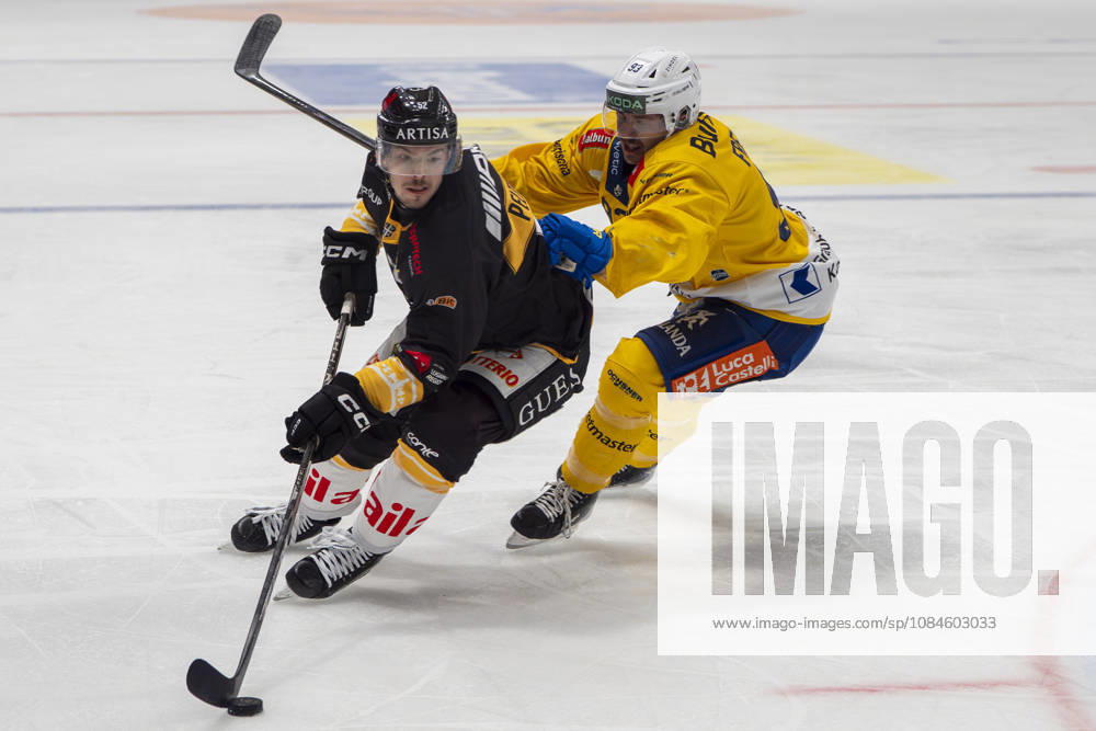 Jesper Peltonen of Lugano L) against Yannick Frehner of Davos R) during the game between HC Lugano v HC Davos at the Corner Arena on October 16, 2026 in Lugano, Switzerland. Lugano Ticino Switzerland