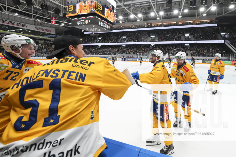 Frederic Allard of Davos C) celebrates his goal with goalkeeper Luca Hollenstein of Davos 2nd L) during the game between HC Lugano v HC Davos at the Corner Arena on October 16, 2026 in Lugano, Switzerland. Lugano Ticino Switzerland