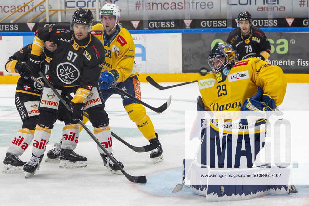 goalkeeper Sandro Aeschlimann of Davos R) saves during the game between HC Lugano v HC Davos at the Corner Arena on October 16, 2026 in Lugano, Switzerland. Lugano Ticino Switzerland