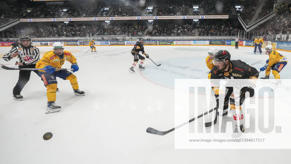 Luca Fazzini of Lugano R) against Ken Jager of Davos L) during the game between HC Lugano v HC Davos at the Corner Arena on October 16, 2026 in Lugano, Switzerland. Lugano Ticino Switzerland