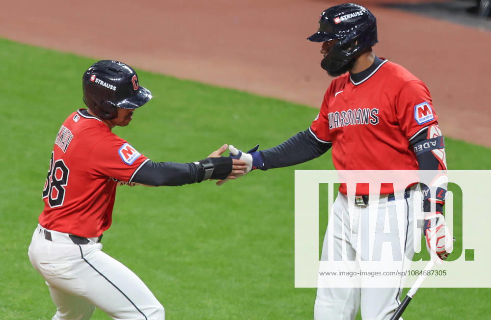Cleveland Guardian Steven Kwan (38) is congratulated by Jo Adell after scoring on a hit by Chase DeLauter in the first inning against the Tampa Bay Rays during game four of the MLB, Baseball Herren, USA American League Championship Series at Progressive Field in Cleveland, Ohio, on Saturday, October 17, 2026. CLE20261017706 AARONxJOSEFCZYK