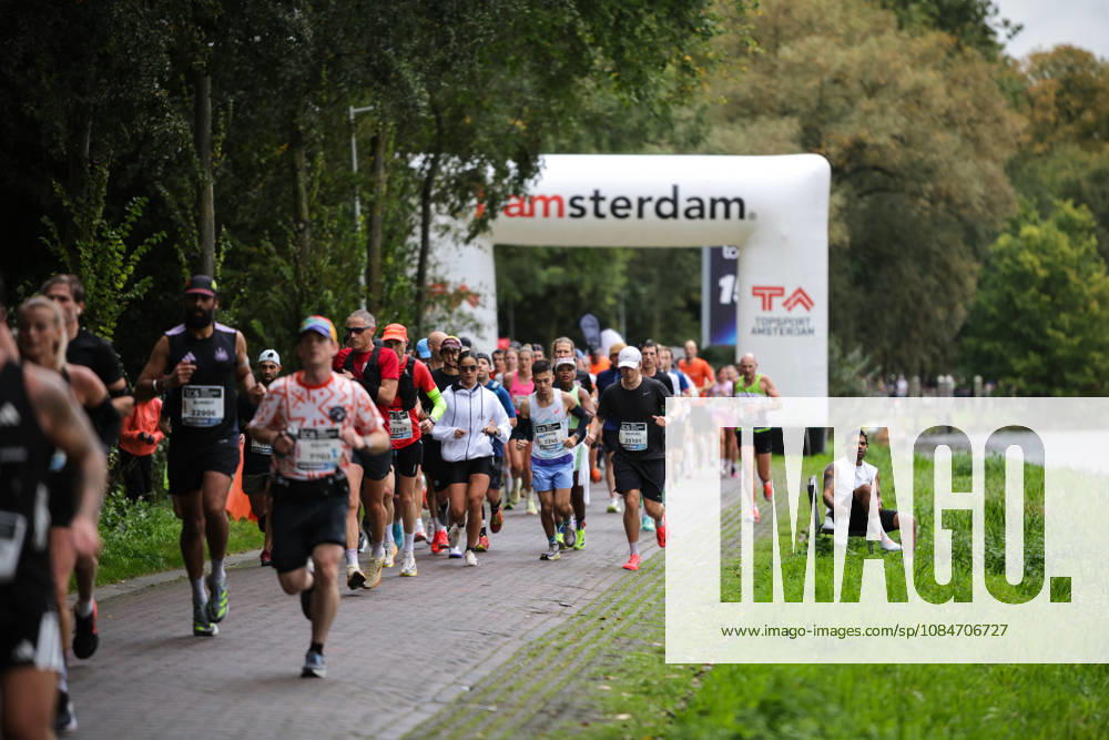 18th October 2026; Amsterdam, Netherlands; TCS Amsterdam Marathon; A runner stops on Amsteldijk AnthonyxBenoit