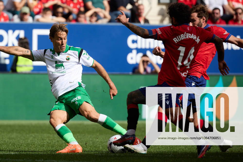 LaLiga EASports 2026 27 CA Osasuna v Racing de Santander Sergio Canales (20. RAC) (L) takes a shot under pressure from Ruben Garcia (14. OSA) and Jon Moncayola (7. OSA) (R) during the football match of LaLiga EA Sports between CA Osasuna and Racing de Santander played at El Sadar stadium in Pamplona (Spain) on Oct 18 2026. Credit: Inigo Alzugaray Agencia LOF Pamplona LaLiga EASports 2026 27 CA Osasuna v Racing de Santander