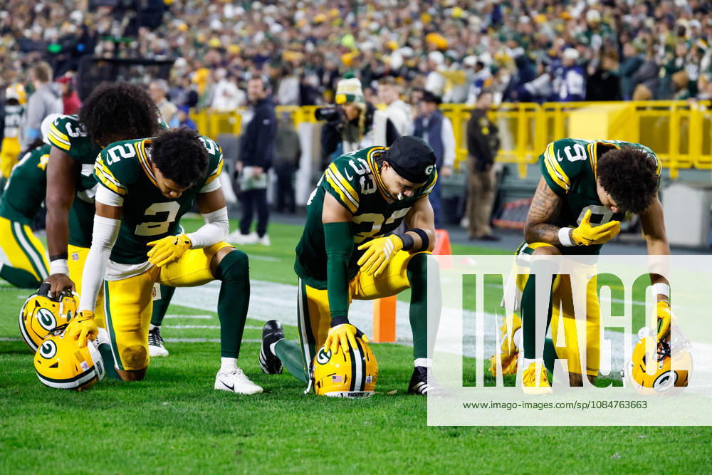 Oct 18, 2026; Green Bay, WI, USA; Green Bay Packers cornerback Brandon Cisse (2), safety Evan Williams (33), and wide receiver Christian Watson (9) praying before the NFL, American Football Herren, USA game against the Dallas Cowboys at Lambeau Field. Mandatory Credit: -Cal Media. NFL 2026: Cowboys Vs Packers OCT 18 - ZUMAc04_ 20261018_zma_c04_459