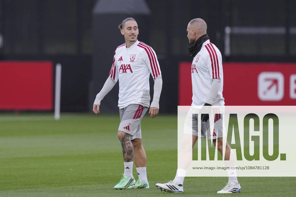 Liverpool Training, Champions League Konstantinos Tsimikas of Liverpool FC speaks with Alexis Mac Allister of Liverpool FC as they walk out to train during the Liverpool Training Session ahead of the UEFA Champions League Matchday 3 v Villarreal CF, AXA Training Centre, Liverpool, United Kingdom on 19 October 2026 Credit: Steve Flynn Every Second Media Editorial use only. All images are copyright Every Second Media Limited. No images may be reproduced without prior permission.
