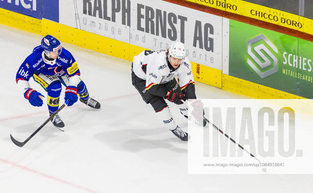 Ice hockey, Eishockey National League Regular Season - EHC Kloten vs Lausan Kloten, Switzerland, 20th Oct 2026: 19 Ray Fust (Lausanne) defends the puck against 63 Fabio Murer (Kloten).