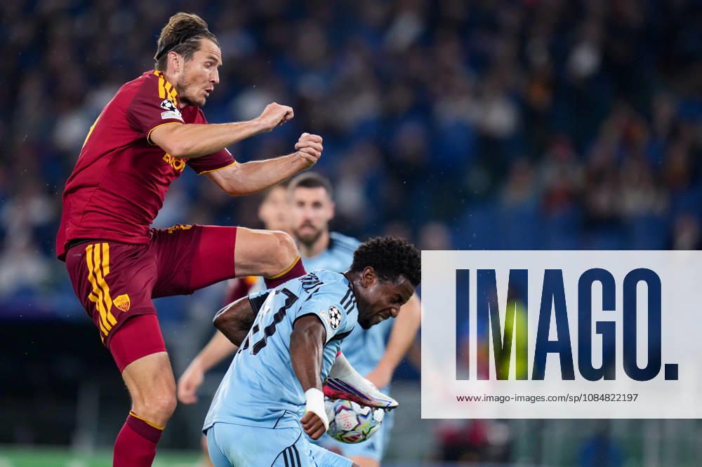 AS Roma v SK Slovan Bratislava - UEFA Champions League 2026 27 League Phase MD3 Marten de Roon of AS Roma and Suleiman Camara of SK Slovan Bratislava compete for the ball during the AS Roma v SK Slovan Bratislava. - UEFA Champions League 2026 27 League Phase MD3 at Stadio Olimpico on October 20, 2026 in Rome, Italy Rome Stadio Olimpico Lazio Italy