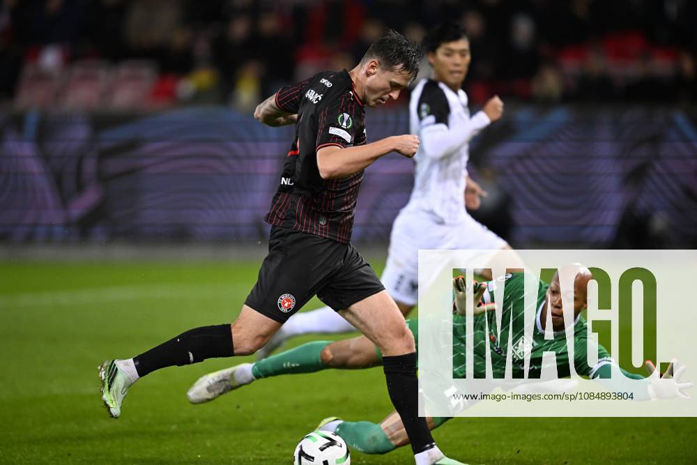 FC Midtjylland v Sint-Truidense VV - UEFA Conference League HERNING, DENMARK - OCTOBER 22 : Rajovic Mileta forward of Midtjylland and Kokubo Leo goalkeeper of Sint-Truidense VV during the UEFA Conference League 2026 27 League Phase matchday 2 match between FC Midtjylland and Sint-Truidense VV on October 22, 2026 in Herning, Denmark, 22 10 2026 Herning Denmark