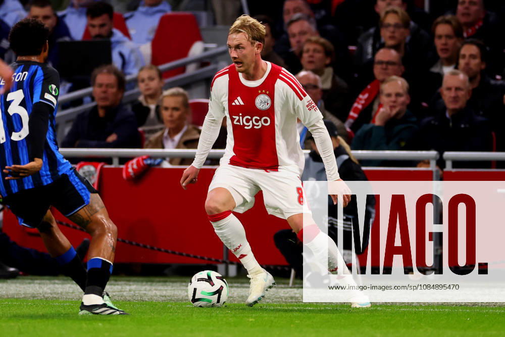 Julian Brandt of AFC Ajax dribbles during the UEFA Conference League 2026 27 League Phase MD2 match between AFC Ajax and Atalanta BC at Johan Cruijff ArenA on October 22, 2026 in Amsterdam, Netherlands.