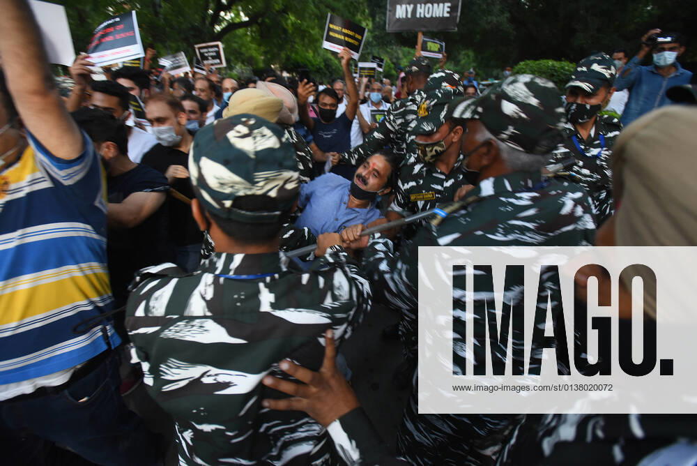 Delhi Police and Paramilitary Forces attempt to stop the members of Kashmiri Pandit Community during a protest and vigil candle march from Jantar Mantar to Connaught Place against the recent killings of people belonging to their community in Srinagar, Jammu and Kashmir, on October 9, 2021 in New Delhi, India. (Photo by Raj K Raj Hindustan Times ) Members Of Kashmiri Pandit Community Protest Against The Recent Killings Of People In Srinagar