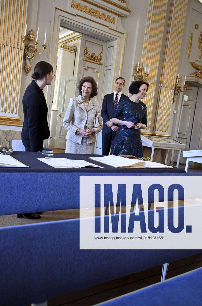 The Permanent Secretary of the Swedish Academy, Mats Malm, Mrs Jenni Haukio, and Queen Silvia look at historical documents during their visit to the Swedish Academy in Stockholm, Sweden, May 18, 2022 Finland’s President is on a two day state visit to Sweden STOCKHOLM SWEDEN