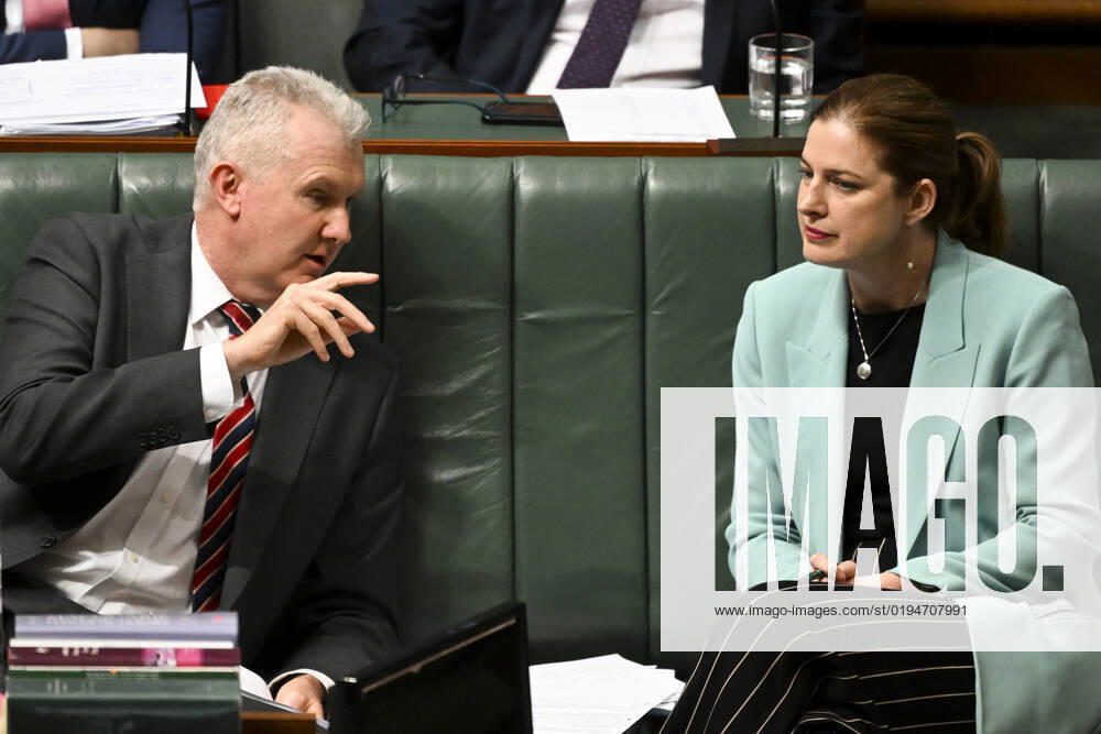 QUESTION TIME, Australian Small Business Minister Julie Collins (right) and Australian Workplace Relations Minister Tony Burke react during Question Time in the House of Representatives at Parliament House in Canberra, Tuesday, November 22, 2022. ( NO ARCHIVING, , NO USE IN BOOKS WITHOUT CONSENT CANBERRA AUSTRALIAN CAPITAL TERRITORY AUSTRALIA