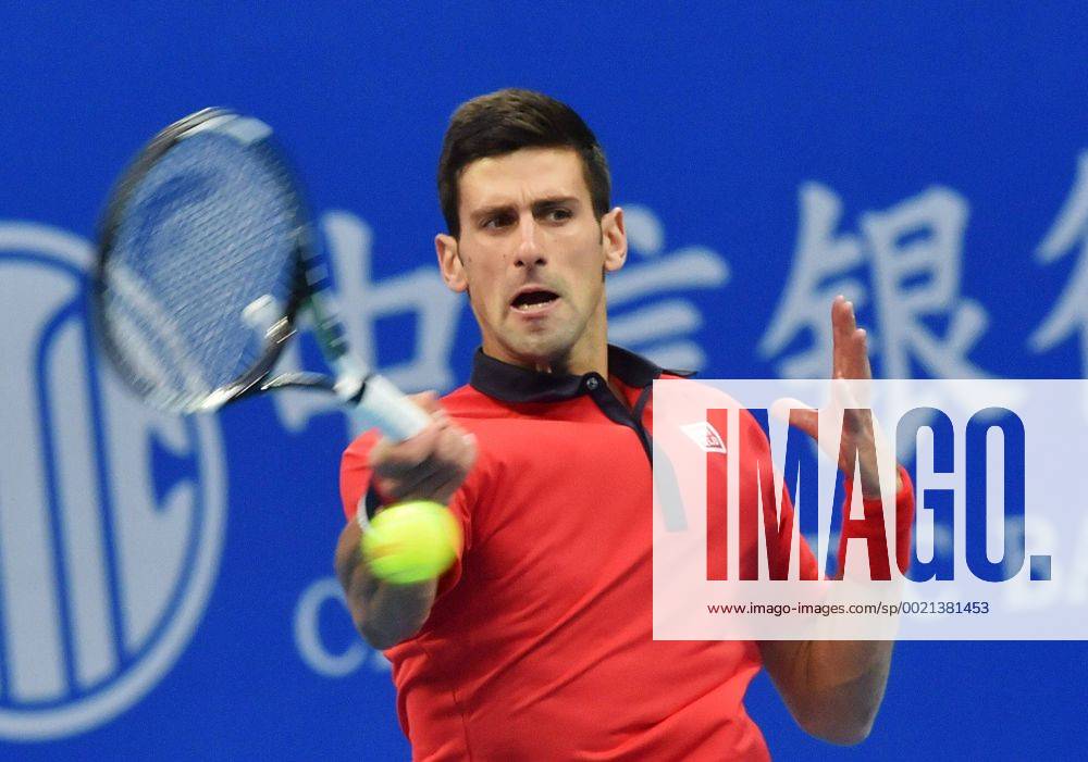 (151008) -- BEIJING, Oct. 8, 2015 -- Novak Djokovic of Serbia hits a return to Zhang Ze of China during their men s singles second round match at the China Open tennis tournament in Beijing, China, Oct. 8, 2015. Djokovic was qualified for the next round after beating Zhang 2-0. ) (SP)CHINA-BEIJING-TENNIS-CHINA OPEN-MEN S SINGLES-DJOKOVIC LixWen