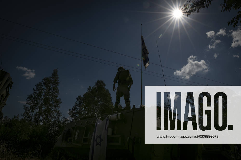 (231017) -- JERUSALEM, Oct. 17, 2023 -- This photo taken on Oct. 16, 2023 shows an Israeli soldier on a military vehicle at a camp near the Israeli-Lebanese border in northern Israel. The Israeli-Lebanese border has seen an escalation of tensions since last week as Hezbollah fired tens of rockets at Israeli military sites on Oct. 8 in support of an onslaught by the Gaza-ruling Palestinian Islamic Resistance Movement (Hamas) on Israel on Oct. 7. Hezbollah on Monday announced that it targeted five Israeli sites with rocket-propelled grenades and machine guns and inflicted Israeli injuries, to which Israel responded by firing seven missiles toward Hezbollah positions in the border town of Rmeish and shelling several Lebanese areas. ) ISRAEL-L