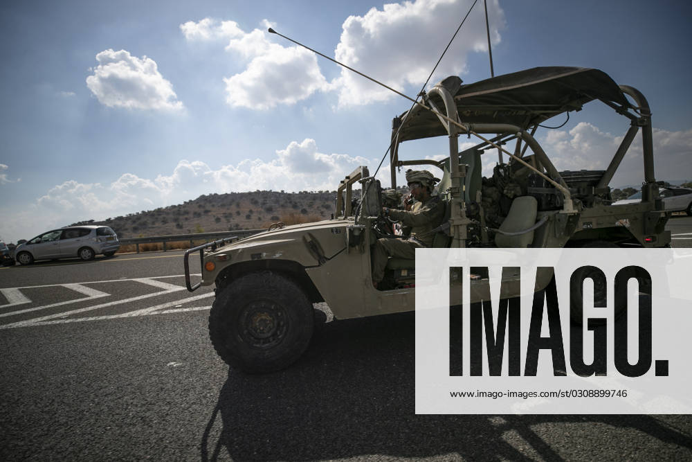 (231017) -- JERUSALEM, Oct. 17, 2023 -- This photo taken on Oct. 16, 2023 shows an Israeli soldier on a military vehicle running on a road near the Israeli-Lebanese border in northern Israel. The Israeli-Lebanese border has seen an escalation of tensions since last week as Hezbollah fired tens of rockets at Israeli military sites on Oct. 8 in support of an onslaught by the Gaza-ruling Palestinian Islamic Resistance Movement (Hamas) on Israel on Oct. 7. Hezbollah on Monday announced that it targeted five Israeli sites with rocket-propelled grenades and machine guns and inflicted Israeli injuries, to which Israel responded by firing seven missiles toward Hezbollah positions in the border town of Rmeish and shelling several Lebanese areas. )