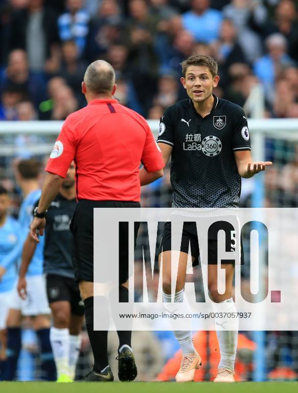 20th October 2018, Etihad Stadium, Manchester, England; EPL Premier League football, Manchester City versus Burnley; James Tarkoski of Burnley disputes a decision of referee Jon Moss ActionPlus12071487 DavidxBlunsden