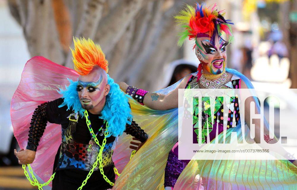 Oceanside, California, USA - 10 8 2016 Oceanside, CA_EARTH INTRUDER, left, and GLAM GLITZ, at right, make their way down Pier View Way in downtown Oceanside, California at the annual North County Pride at the Beach festival. The event was sponsored by the North County LGBTQ Resource Center. They were the event s MC s._Photo by Oceanside USA - ZUMAn47_