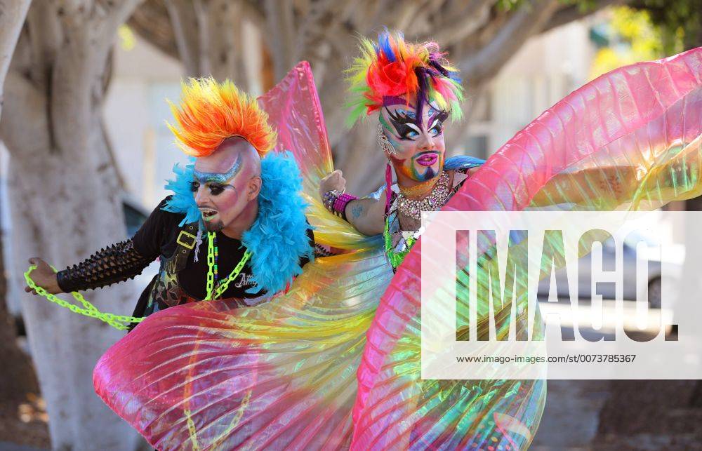 Oceanside, California, USA - 10 8 2016 Oceanside, CA_EARTH INTRUDER, left, and GLAM GLITZ, at right, make their way down Pier View Way in downtown Oceanside, California at the annual North County Pride at the Beach festival. The event was sponsored by the North County LGBTQ Resource Center. They were the event s MC s._ Photo by Oceanside USA - ZUMAn47_