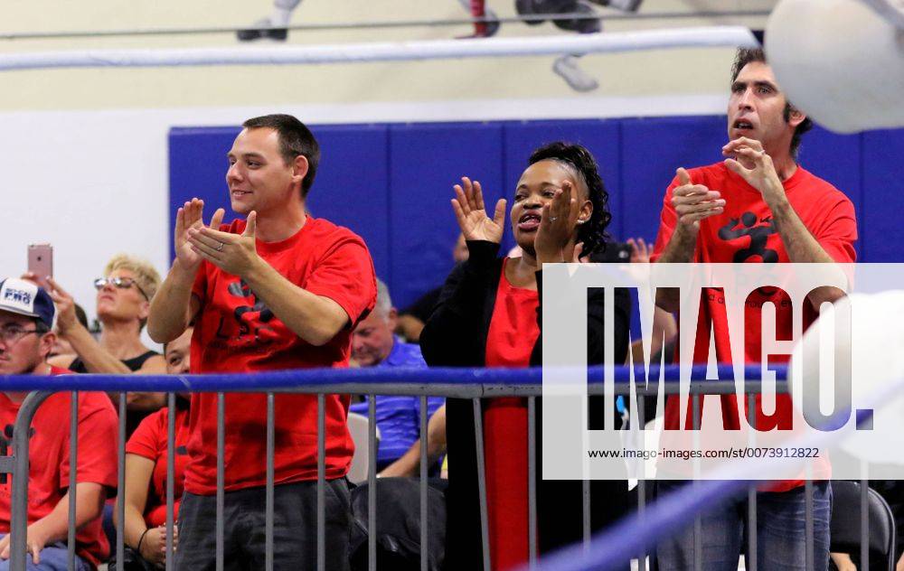 Oceanside, California, USA - 10 15 2016_Oceanside, CA_SoCal Pro Wrestling s Rumble in Oceanside event at the Oceanside Boys & Girls Club gymnasium. Fans cheer the action. Middle is longtime fan Mona Ripley._Photo by Oceanside USA - ZUMAn47_