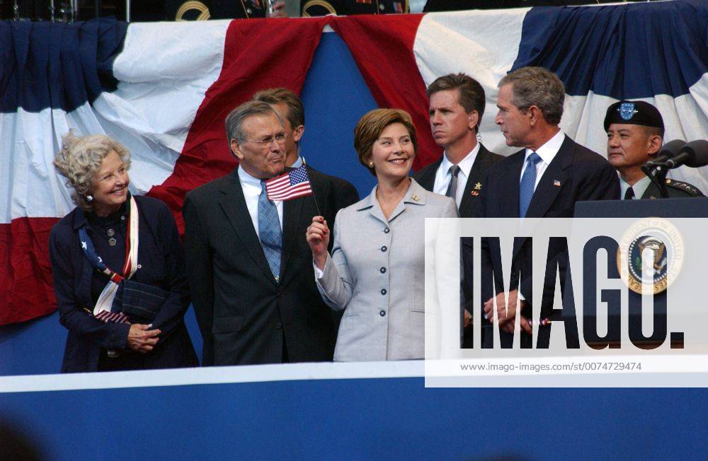 Washington, DC, United States - U.S. President George W. Bush, First Lady Laura Bush, Secretary of Defense Donald Rumsfeld and wife Joyce Rumsfeld attend the September 11 Memorial Service at the Pentagon September 11, 2002 in Washington, DC. Washington United States - ZUMAp138 20020911_zaa_p138_001
