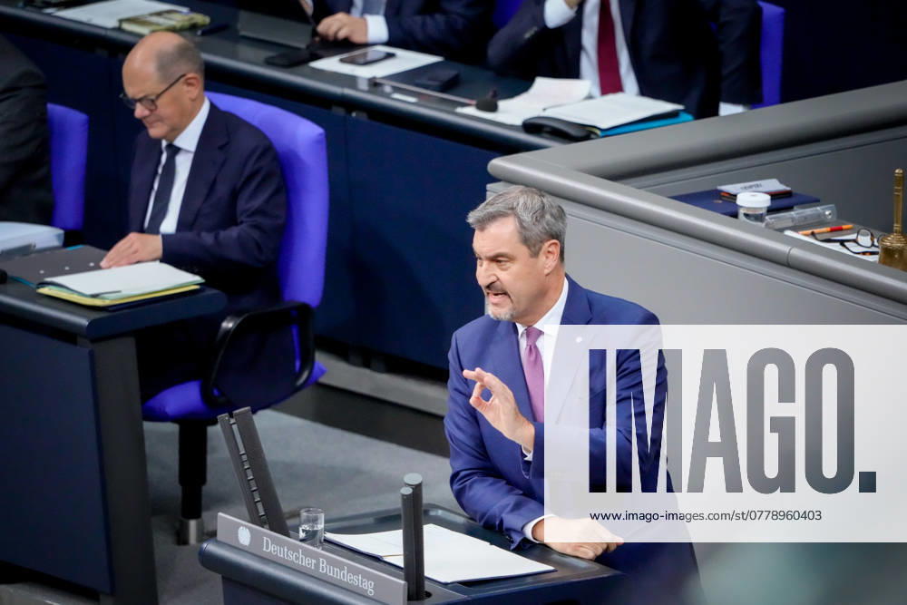 Deutscher Bundestag, 199. Plenarsitzung Markus Soeder (CSU) bei seiner Rede zur Regierungserklaerung zur aktuellen Lage des Bundeskanzlers bei der 199. Sitzung des Deutschen Bundestag mit Bundeskanzler Olaf Scholz im Hintergrund in Berlin, 13.11.2024 Berlin Berlin Deutschland