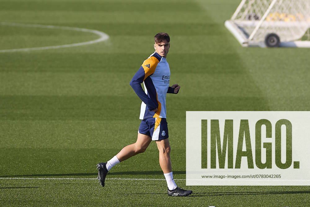 Real Madrid CF Training Session and Press Conference in Madrid, Spain - 03 Dec 2024 Raul Asencio of Real Madrid CF warms up during the training session on the eve of the 2024 2025 La Liga EA Sports week 19 football match between Athletic Club and Real Madrid CF at Ciudad Real Madrid. Madrid Spain