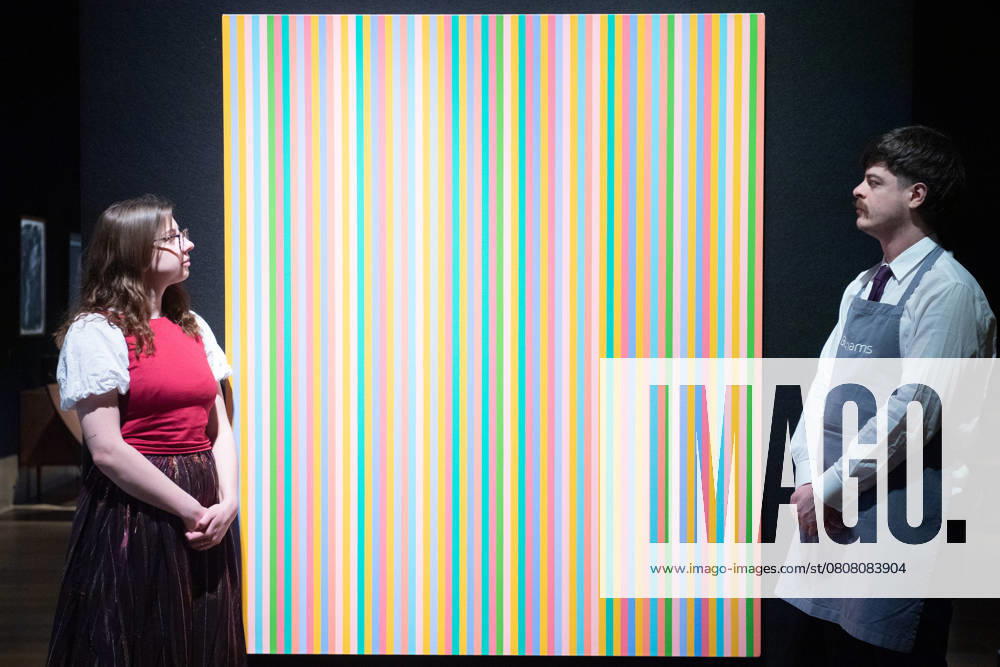 Bonhams 20th 21st Century Art Day Evening Sales Highlights Photocall - Bonhams, London A staff member views Myrrh by Bridget Riley (est £1.5m -£2.5m) which is to go on auction at Bonhams 20th 21st Century Art Day Evening Sales at Bonhams in London, England, UK on Monday 31 March, 2025., Credit:Justin Ng Avalon UK, England, London, Bonhams