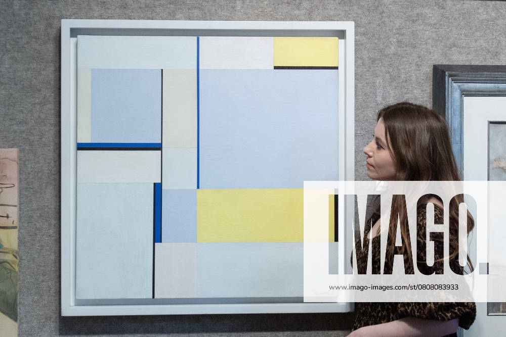 Bonhams 20th 21st Century Art Day Evening Sales Highlights Photocall - Bonhams, London A staff member views Square in 3 Blues (79-109) by Ilya Bolotowsky (est £10k -£15k) which is to go on auction at Bonhams 20th 21st Century Art Day Evening Sales at Bonhams in London, England, UK on Monday 31 March, 2025., Credit:Justin Ng Avalon UK, England, London, Bonhams