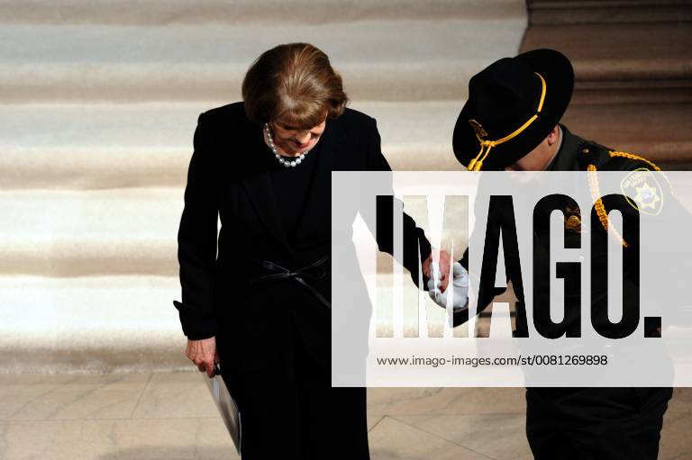 San Francisco, California, USA - Senator Feinstein being escorted by a San Francisco Sheriff s deputy. San Francisco USA - ZUMAw332 20171217_zap_w332_013