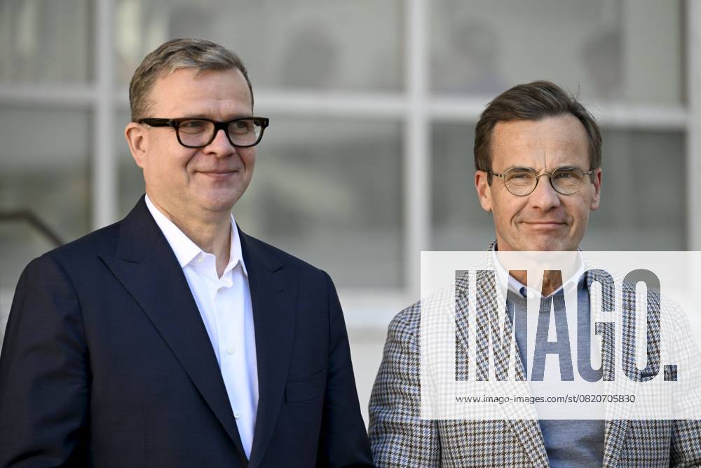 Finnish Prime Minister Petteri Orpo (L) welcomes Swedish Prime Minister Ulf Kristersson at the Nordic Prime Ministers Summer Meeting at the Paimio Sanatorium in Paimio, Finland, on May 26, 2025. Finland and Åland together host the informal summer meeting. The discussions of the meeting will focus on two themes: competitiveness and strengthening comprehensive security. Paimio Finland