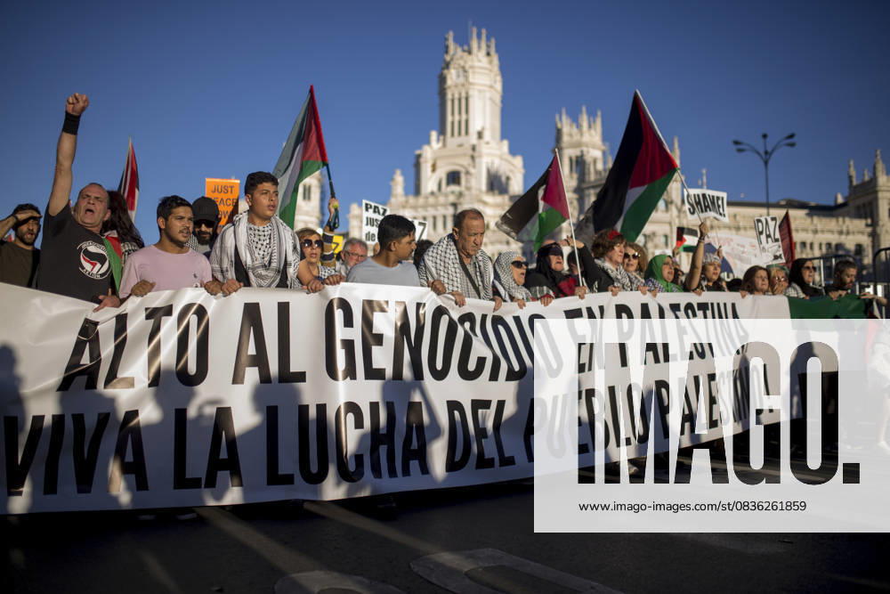 Protesters hold the banner at the top, with the Cibeles Palace visible behind them, during a pro-Palestinian demonstration in central Madrid in solidarity with the Palestinian people in the face of Israeli attacks and condemning the interception by Israeli forces of the Global Sumud Flotilla ships. Madrid Spain - ZUMAs197 20251004_aaa_s197_306