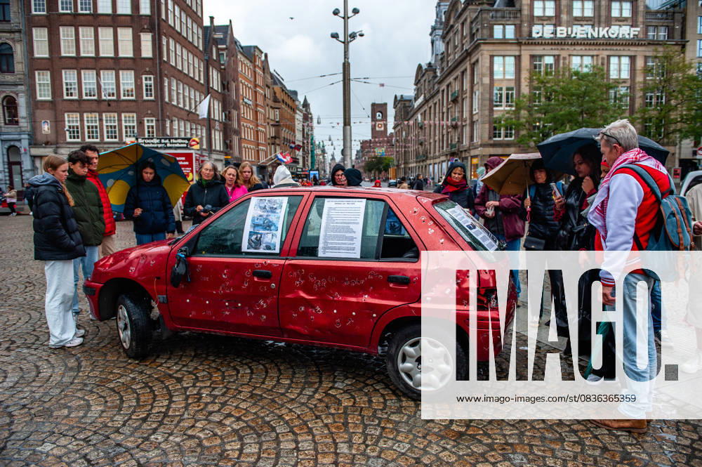 People are seen surrounding the car full of bullets. A vehicle representing five-year-old Hind Rajab and her family, who were killed during an Israeli army attack in the Tel al-Hawa area of Gaza in January 2024, has been exhibited in the Netherlands. Amsterdam Netherlands - ZUMAs197 20251005_aaa_s197_615