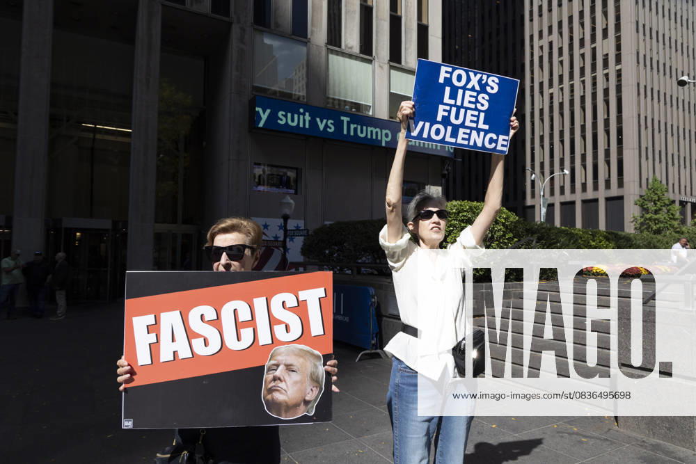 Demonstrators denouncing Fox News as extremist right-wing propaganda in support of President Trump s administration hold signs that read FASCIST with an image of President Trump FOX S LIES FUEL VIOLENCE outside of News Corp s Fox News Channel in midtown Manhattan. Protesters with the activist groups Rise & Resist and Truth Tuesdays come to Fox News weekly for a peaceful demonstration calling for truth in journalism and denouncing authoritarianism, oligarchy, fascism, and Trump s agenda. New York USA - ZUMAr174 20251007_znp_r174_002