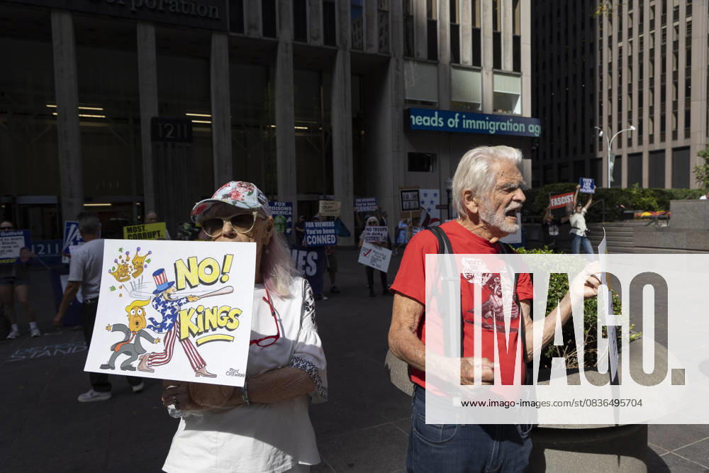 Demonstrators join the activist groups Rise & Resist and Truth Tuesdays chanting and holding a sign that reads a sign that reads NO KINGS! with a cartoon image of President Trump s crown being knocked off his head by Uncle Sam with a baseball bat outside of News Corp s Fox News Channel in midtown Manhattan. Protesters come to Fox News weekly for a peaceful demonstration denouncing authoritarianism, oligarchy, fascism, Fox News as extremist right-wing propaganda in support of President Trump s administration and calling for truth in journalism. New York USA - ZUMAr174 20251007_znp_r174_005