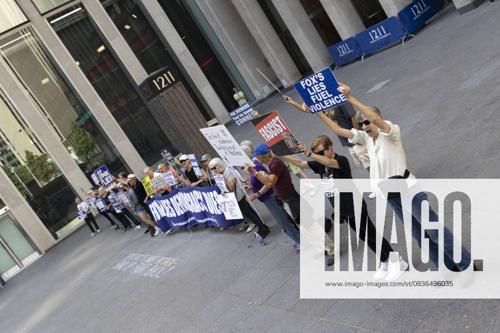 Demonstrators denouncing Fox News as extremist right-wing propaganda in support of President Trump s administration hold signs that read FOX S LIES FUEL VIOLENCE FASCIST with an image of President Trump outside of News Corp s Fox News Channel in midtown Manhattan. Protesters with the activist groups Rise & Resist and Truth Tuesdays come to Fox News weekly for a peaceful demonstration calling for truth in journalism and denouncing authoritarianism, oligarchy, fascism, and Trump s agenda. New York USA - ZUMAr174 20251007_znp_r174_021