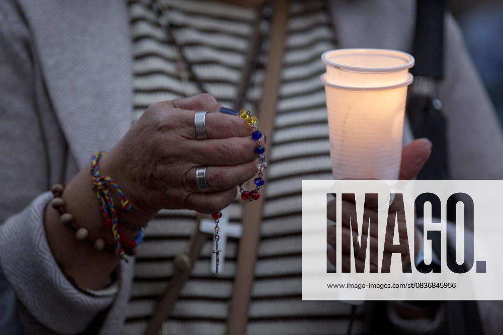 Members of the Venezuelan community in Madrid holding candles and Venezuelan flags in Opera Square in downtown Madrid, during a vigil to pray the rosary for the beatification of Venezuelans Jose Gregorio Hernandez and Carmen Rendiles on October 19, 2027, in St. Peter s Square, Rome. Madrid Spain - ZUMAs296 20251011_znp_s296_008