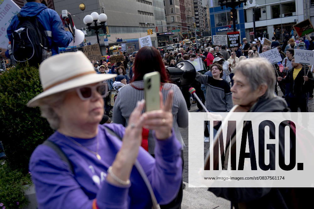 Protesters march down Broadway during the â€oeNo Kings†rally in New York, Saturday, Oct. 18, 2025. The demonstration began in Times Square and ended in Union Square, drawing an estimated 50,000 people who joined others across the country calling for the protection of democratic institutions and denouncing authoritarian leadership. Organizers said more than 5 million people participated in over 2,000 marches nationwide. New York USA - ZUMAa306 20251018_znp_a306_002