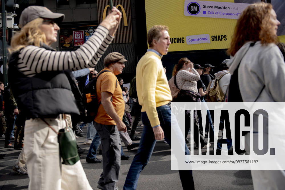 Protesters march down Broadway during the â€oeNo Kings†rally in New York, Saturday, Oct. 18, 2025. The demonstration began in Times Square and ended in Union Square, drawing an estimated 50,000 people who joined others across the country calling for the protection of democratic institutions and denouncing authoritarian leadership. Organizers said more than 5 million people participated in over 2,000 marches nationwide. New York USA - ZUMAa306 20251018_znp_a306_008