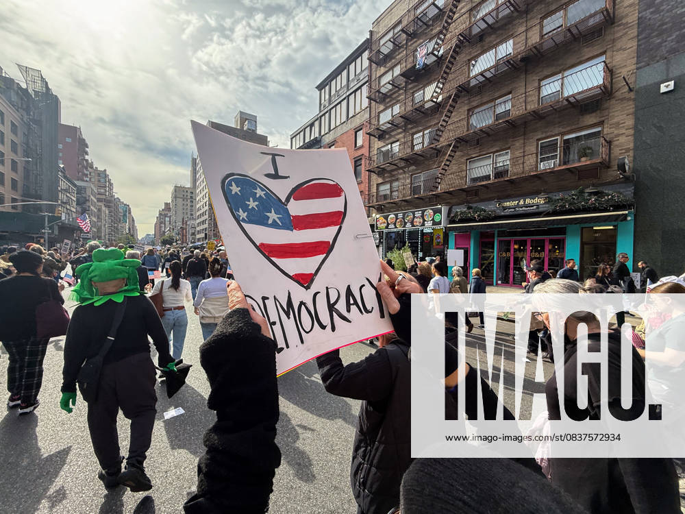 Protesters march in the No Kings Protest against the Trump administration down Seventh Avenue in Chelsea on October 18, 2025 in New York. New York USA - ZUMAb148 20251018_zap_b148_007